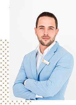 A Portals Hills team member in a light blue suit