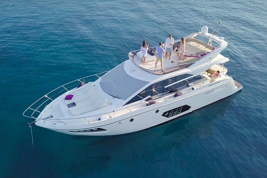 Overhead view of a yacht with celebrating guests in the middle of the sea